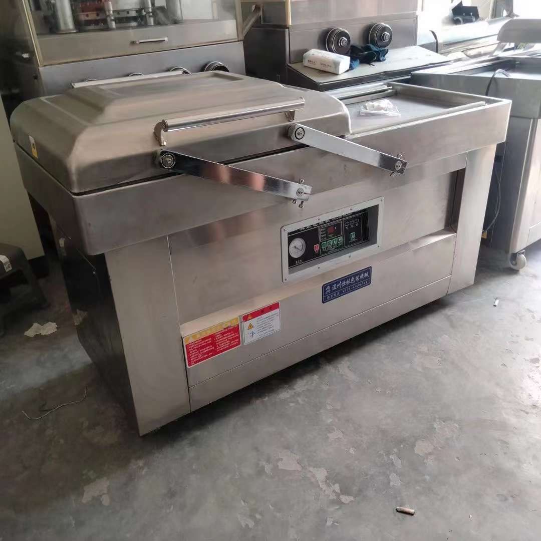 轉(zhuǎn)讓二手真空包裝機(jī) 兩臺(tái)600型雙室凹槽真空包裝機(jī)