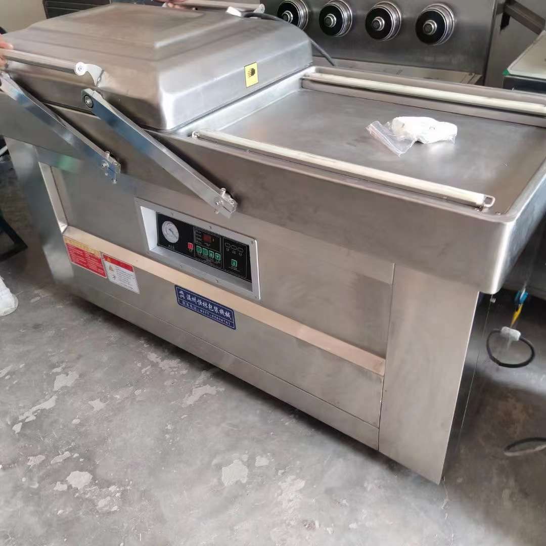 轉(zhuǎn)讓二手真空包裝機(jī) 兩臺(tái)600型雙室凹槽真空包裝機(jī)