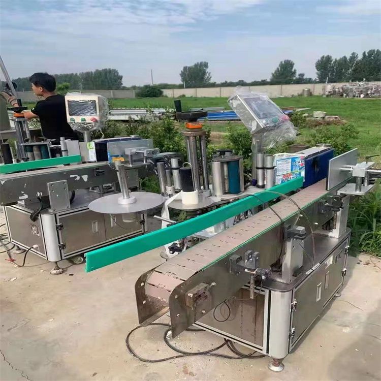 轉(zhuǎn)讓二手單面雙面圓瓶不干膠貼標(biāo)機(jī)自動(dòng)定位