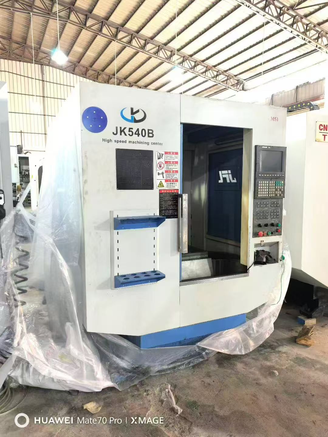 刚到仓库15台准新T600,新代22MA系统,2万转主轴,带油冷机