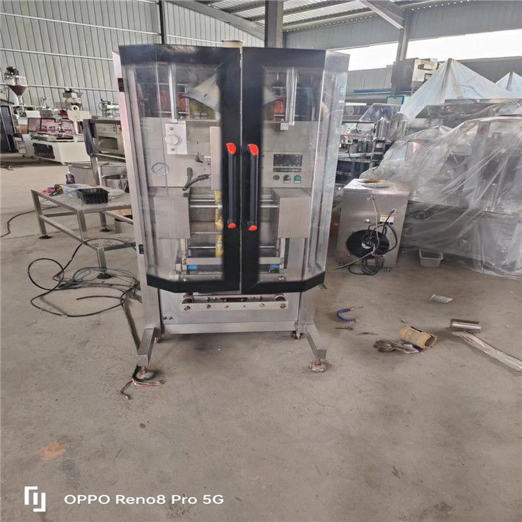 转让二手制热盒饭热缩膜枕式包装机 玉米滚动式包装机 立式液体包装机