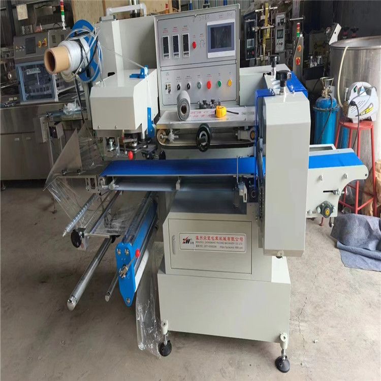 转让二手制热盒饭热缩膜枕式包装机 玉米滚动式包装机 立式液体包装机